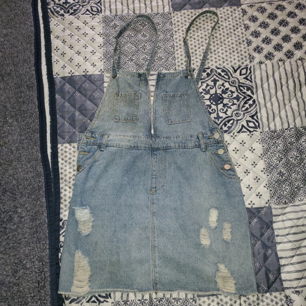 Distressed denim overall dress.